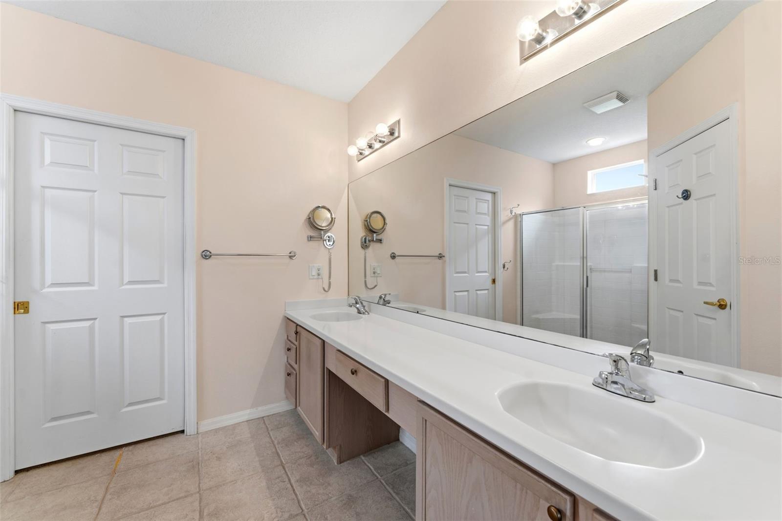 Dual split vanities in the primary bathroom.