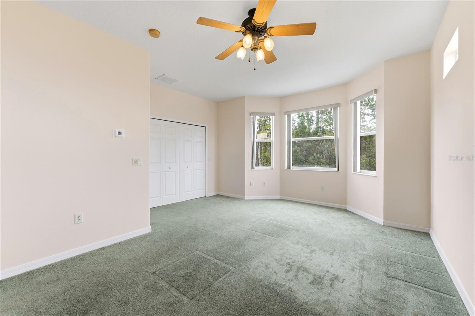 The upstairs bedroom with a bay window with good natural light.