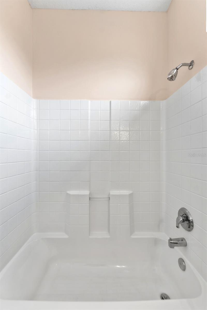 The tub/shower of the upstairs suite.