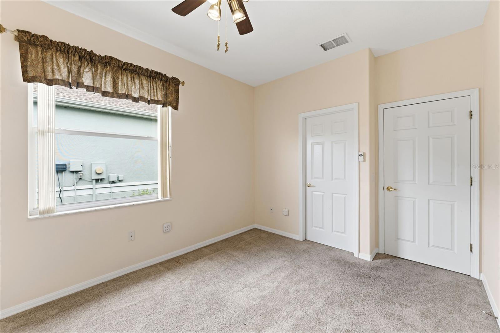 The large walk-in closet of the second bedroom has ample storage too!