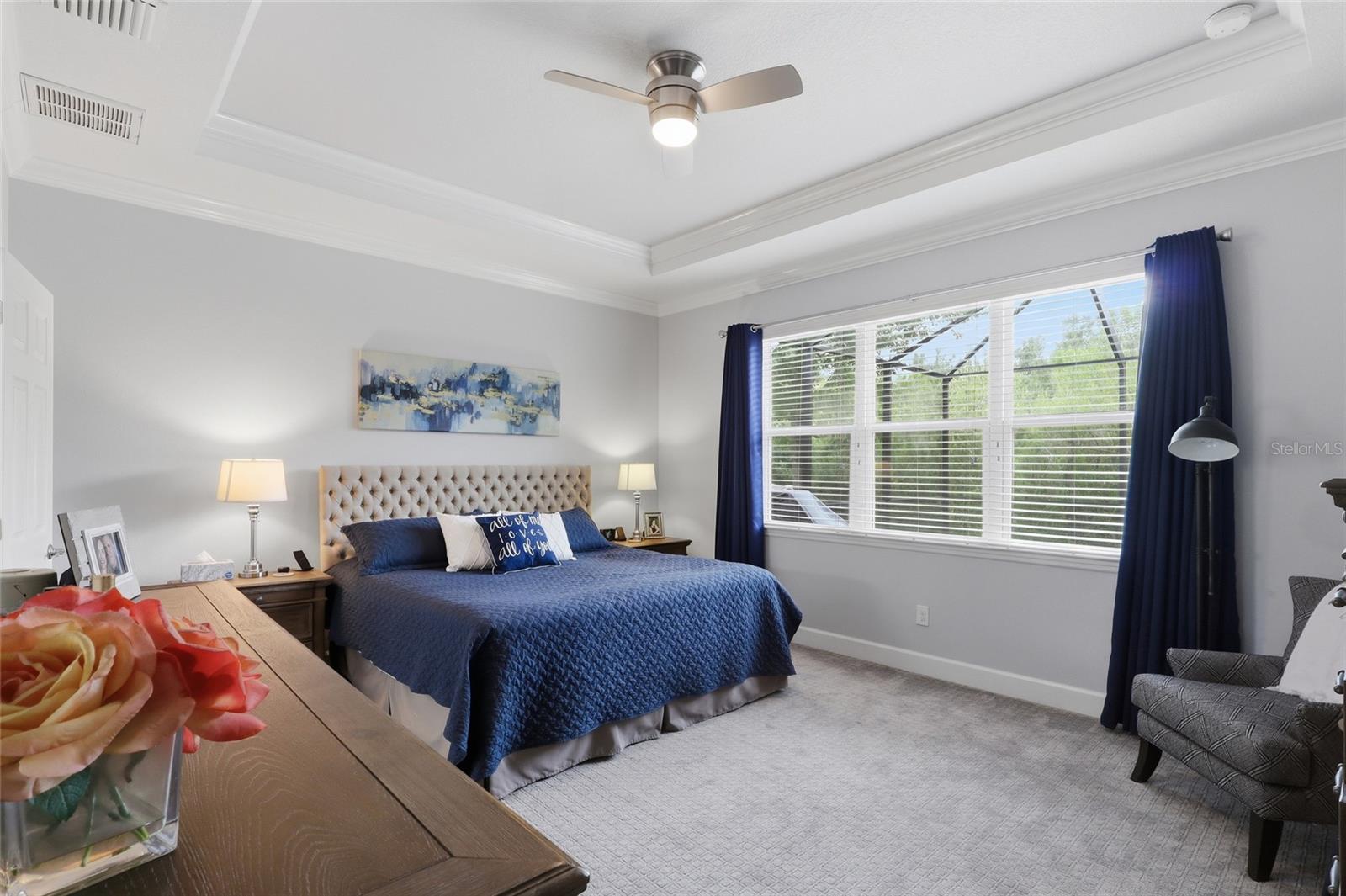 Primary suite with tray ceilings and crown molding