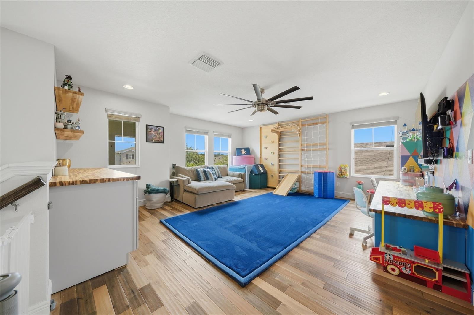 Upstairs, a spacious loft provides the perfect second living area, ideal as a media room, game room, playroom, or a comfortable retreat for family and guests.
