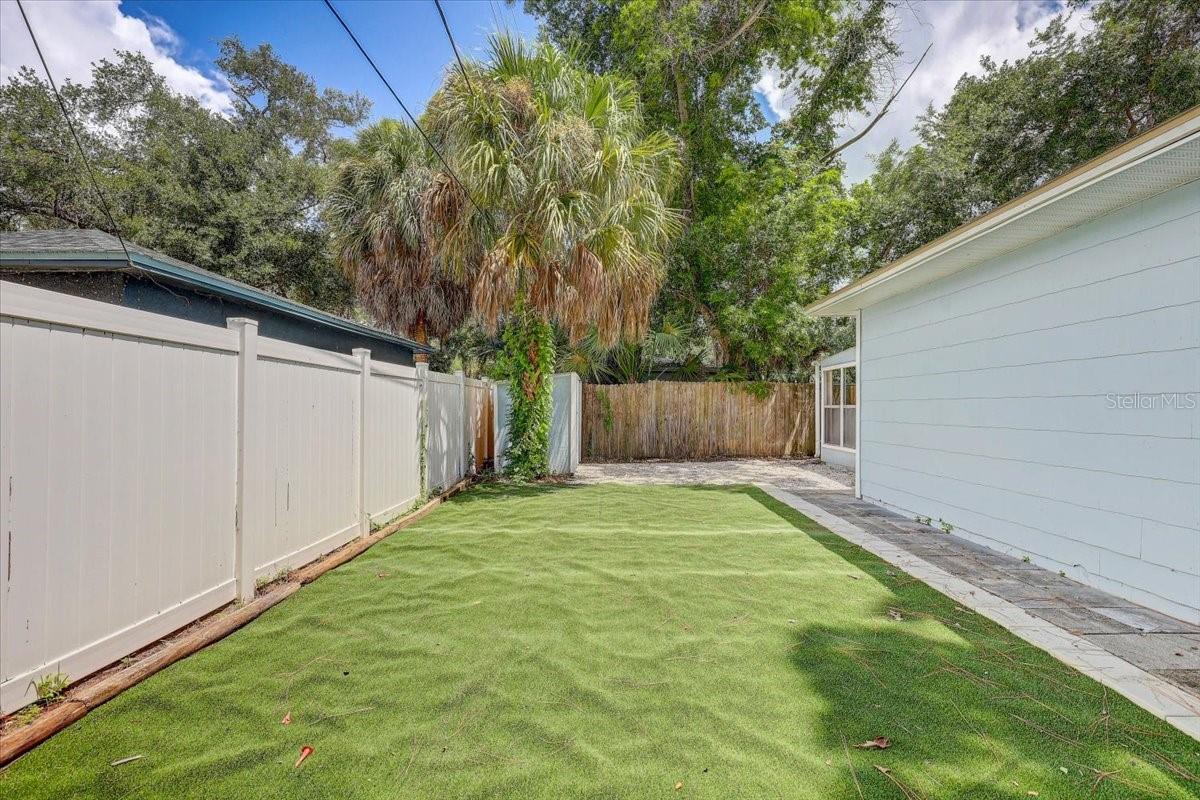 Low maintenance Backyard with turf