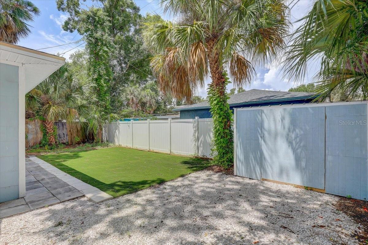 Low maintenance Backyard with turf
