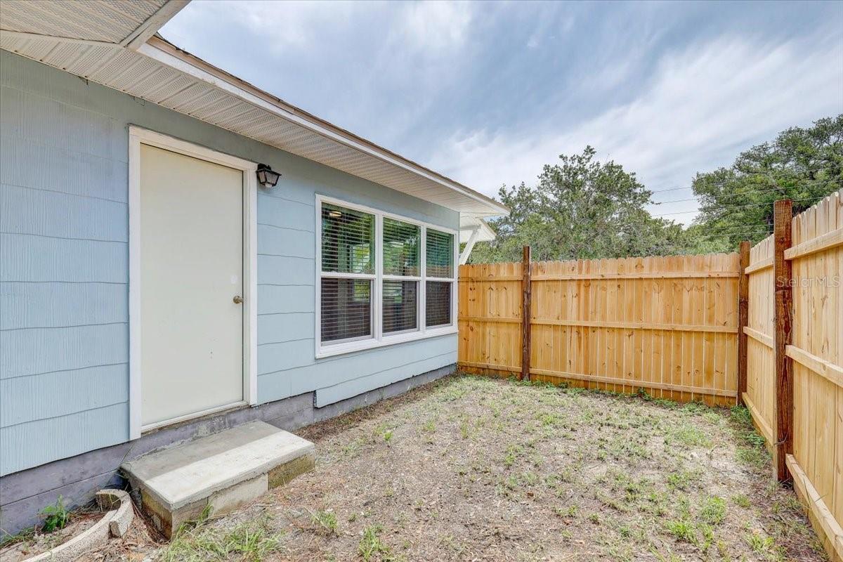 Side door/side yard with a seperate perfect for pets