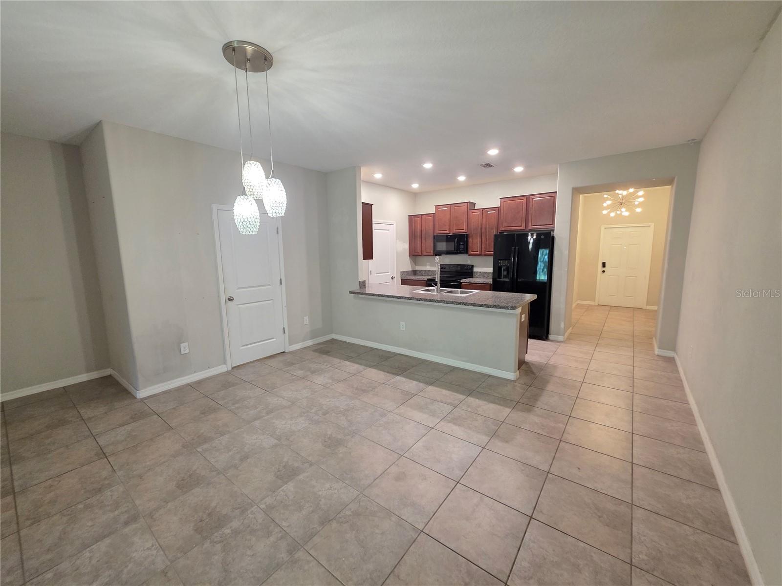 Large Dining Room and large bar to kitchen.