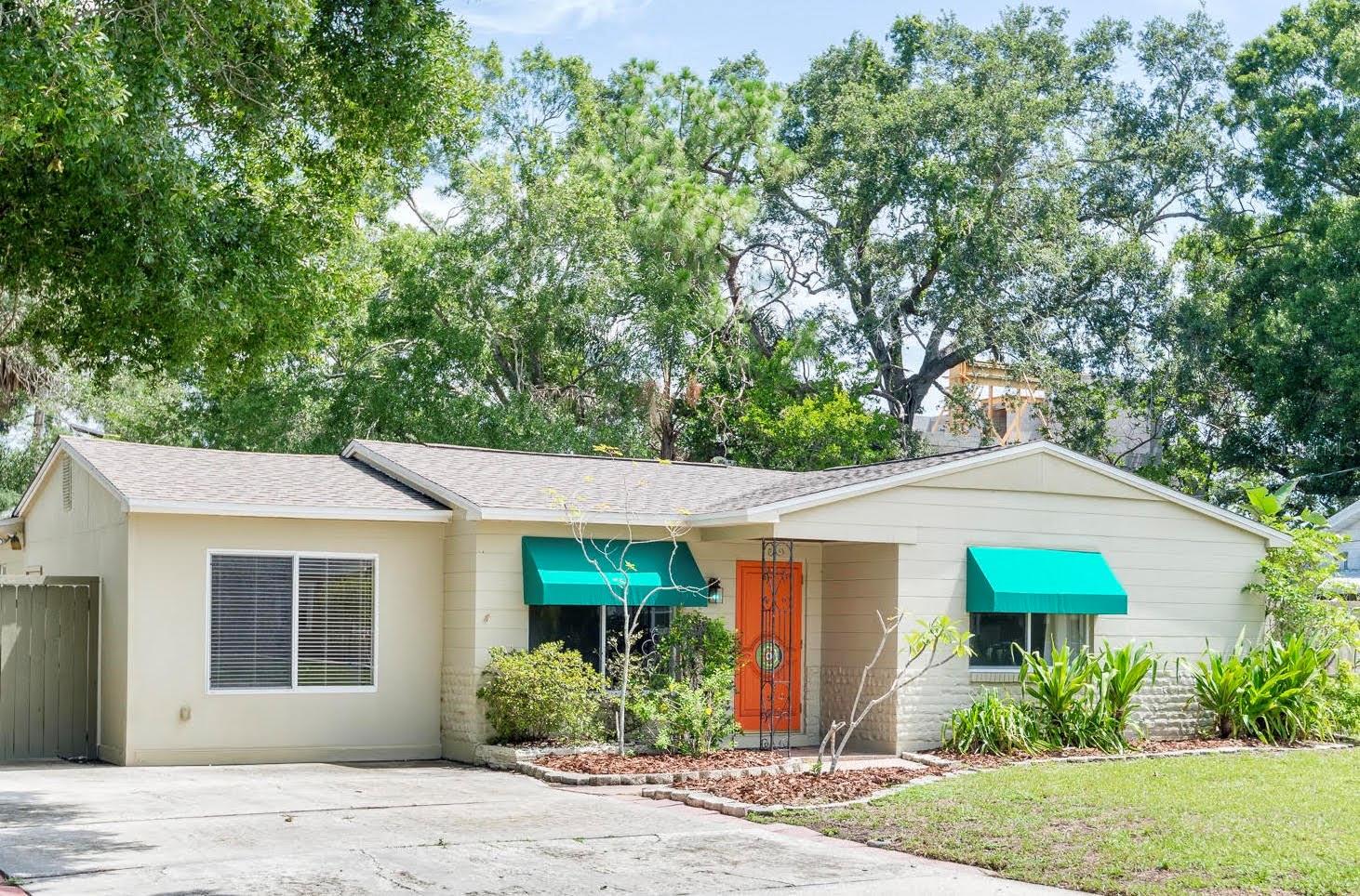 Home is located in a well-established neighborhood with mature trees.