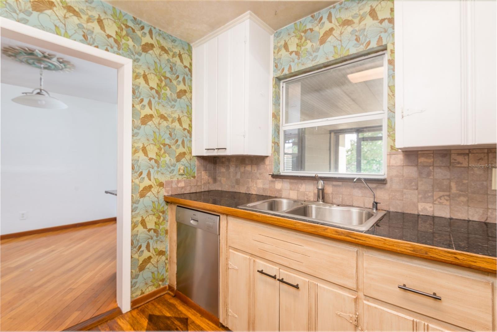 Seller has drawings that illustrate opening the kitchen to enlarge it.