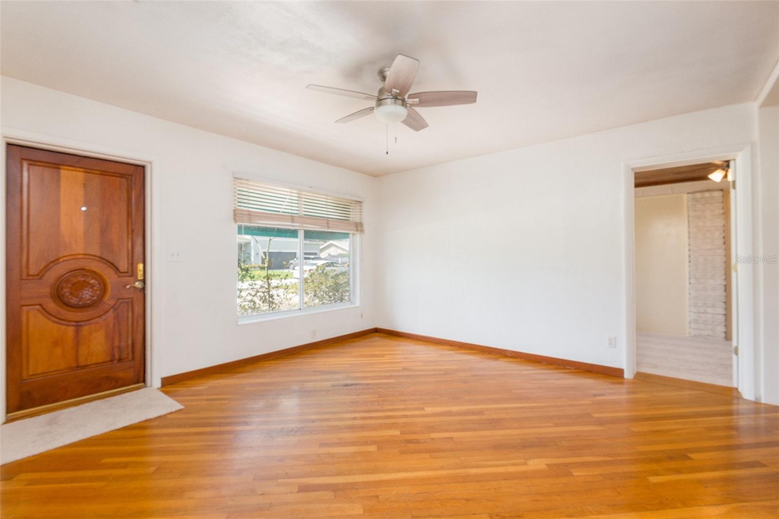 Front door is solid mahogany. Living room has entrance to bonus room.