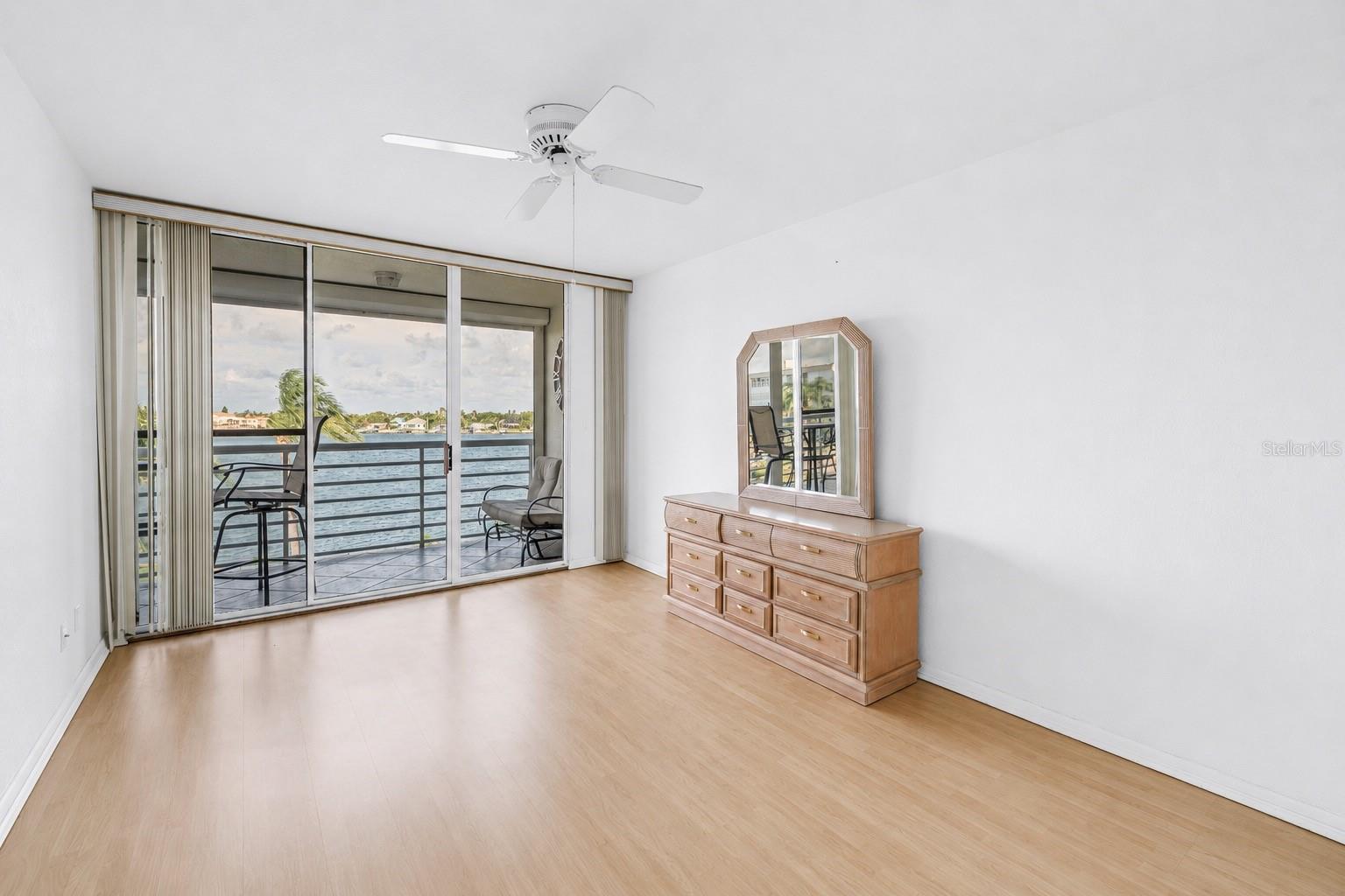 Primary Bedroom with access to Balcony and SW water views