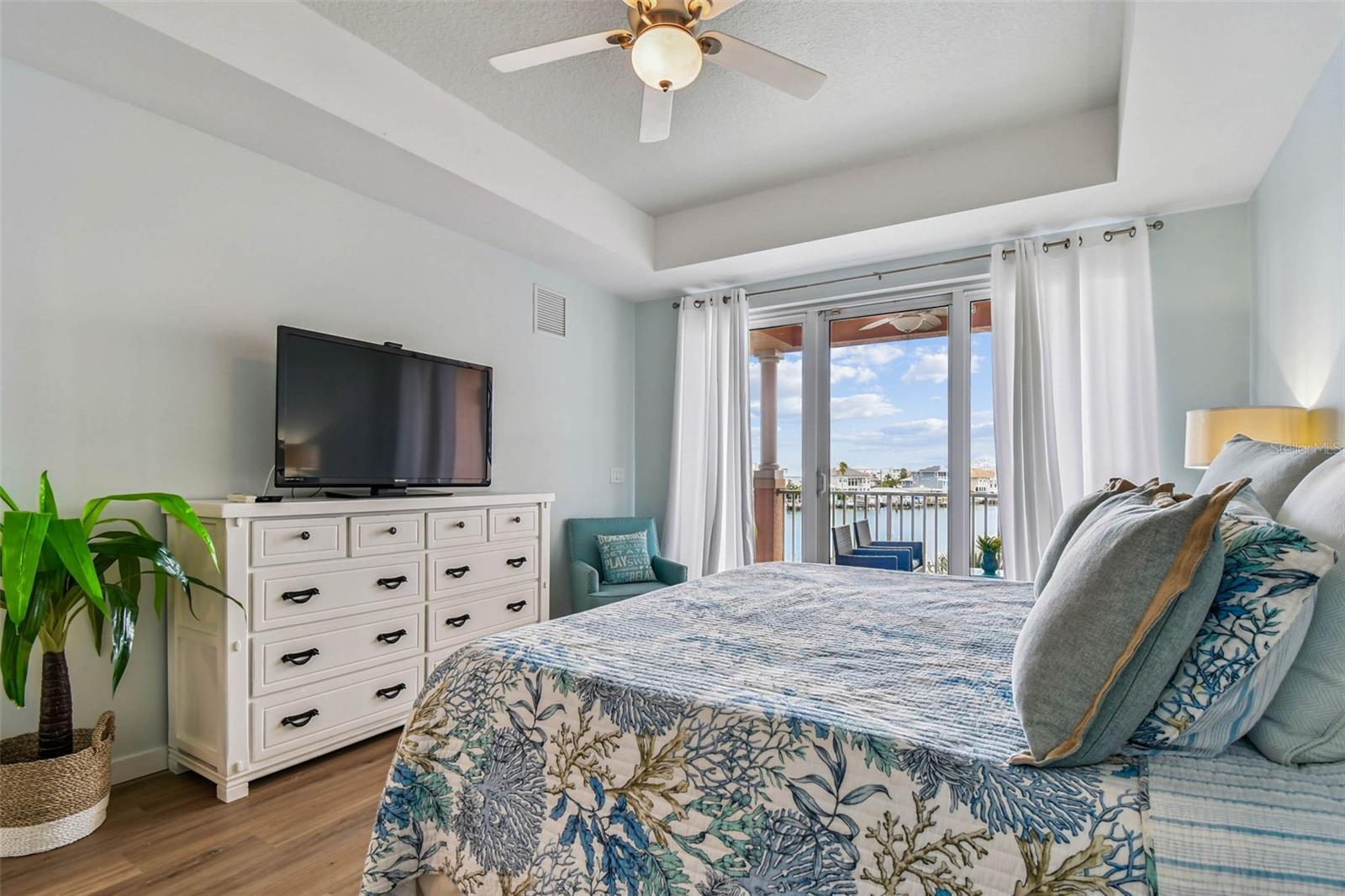 Primary bedroom provides light and views from sliders in master bedroom