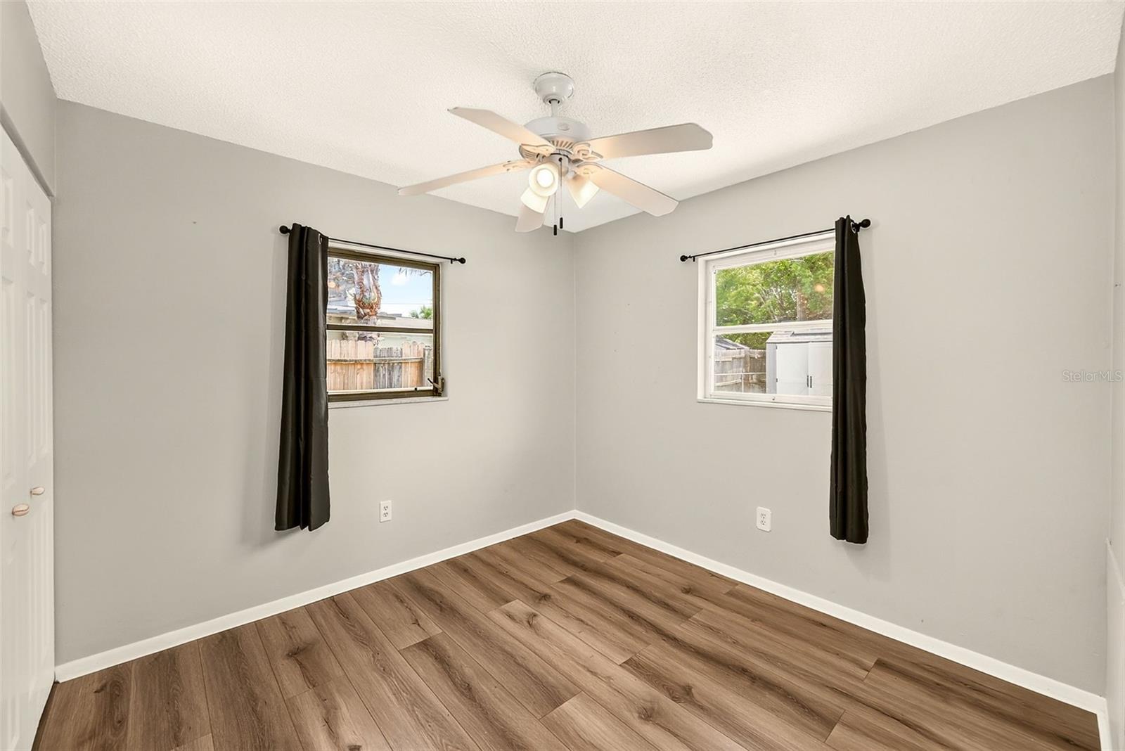 Bedroom Three with newer vinyl plank flooring