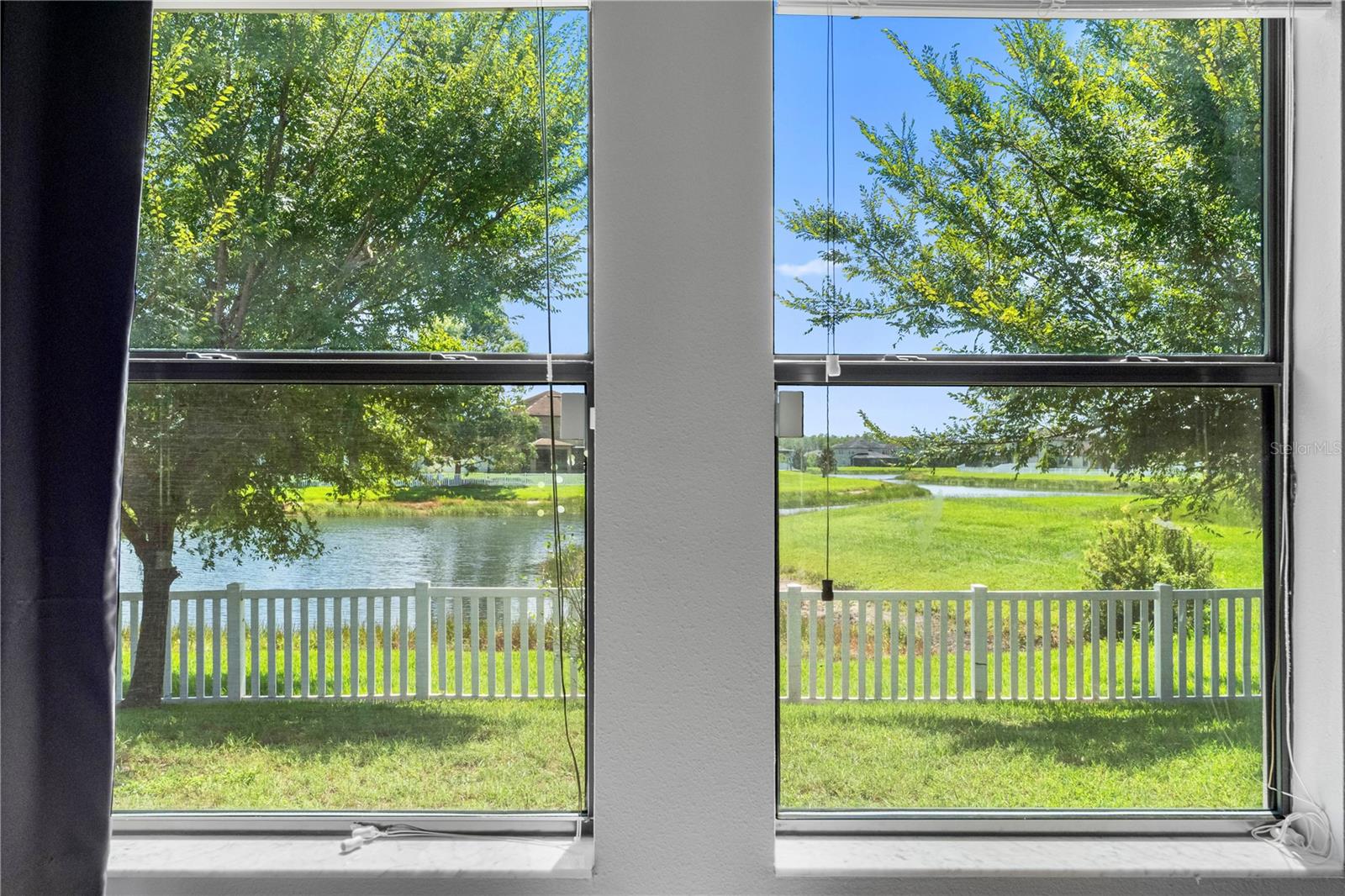 Primary bedroom with pond view