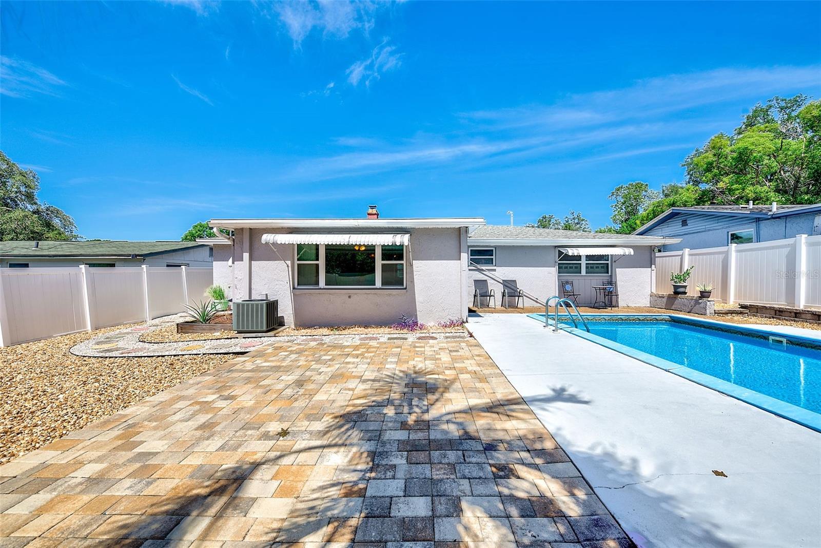 View of backyard with inground swimming pool