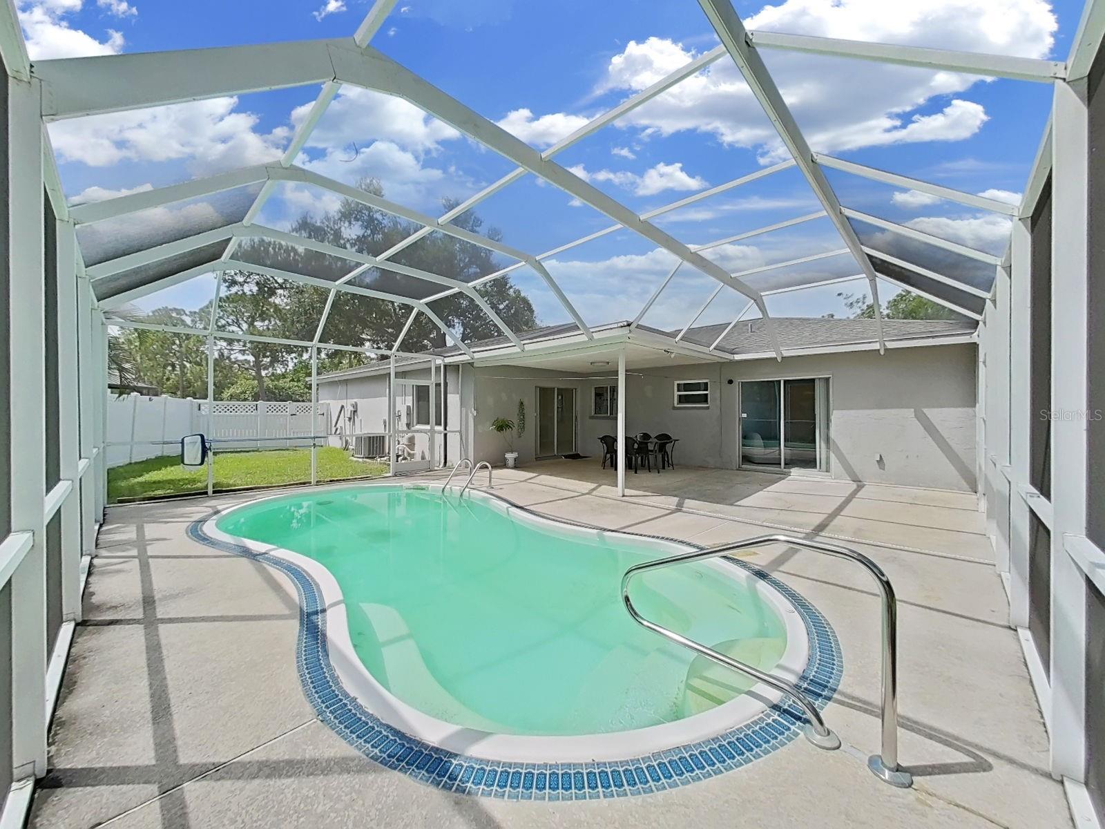 Pool with large screen enclosure