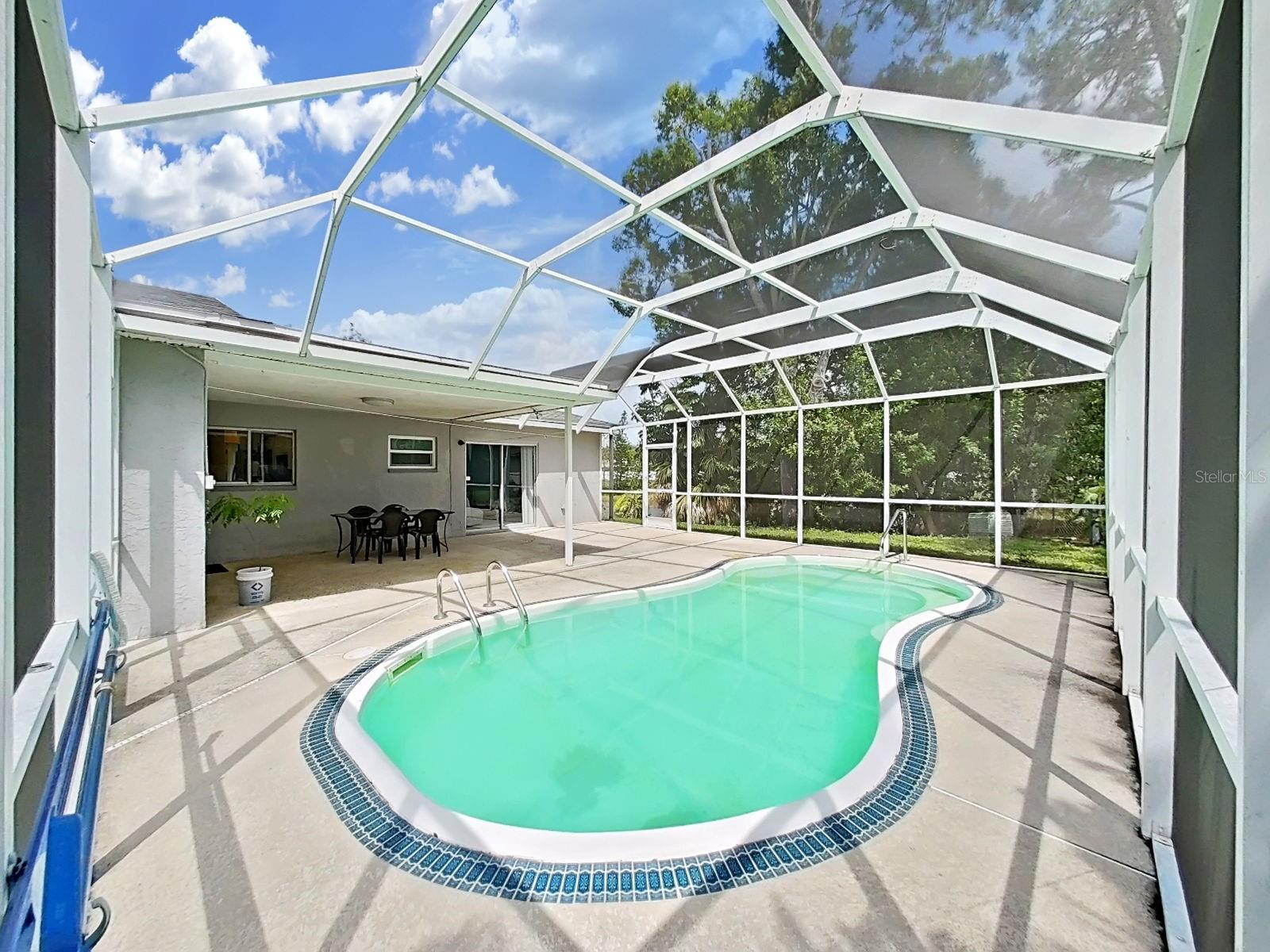 Pool with large screen enclosure