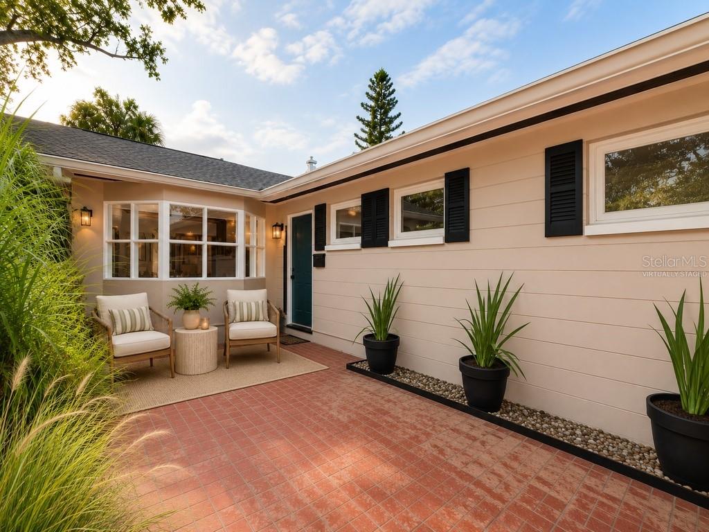 Virtually staged exterior front entrance of Main House