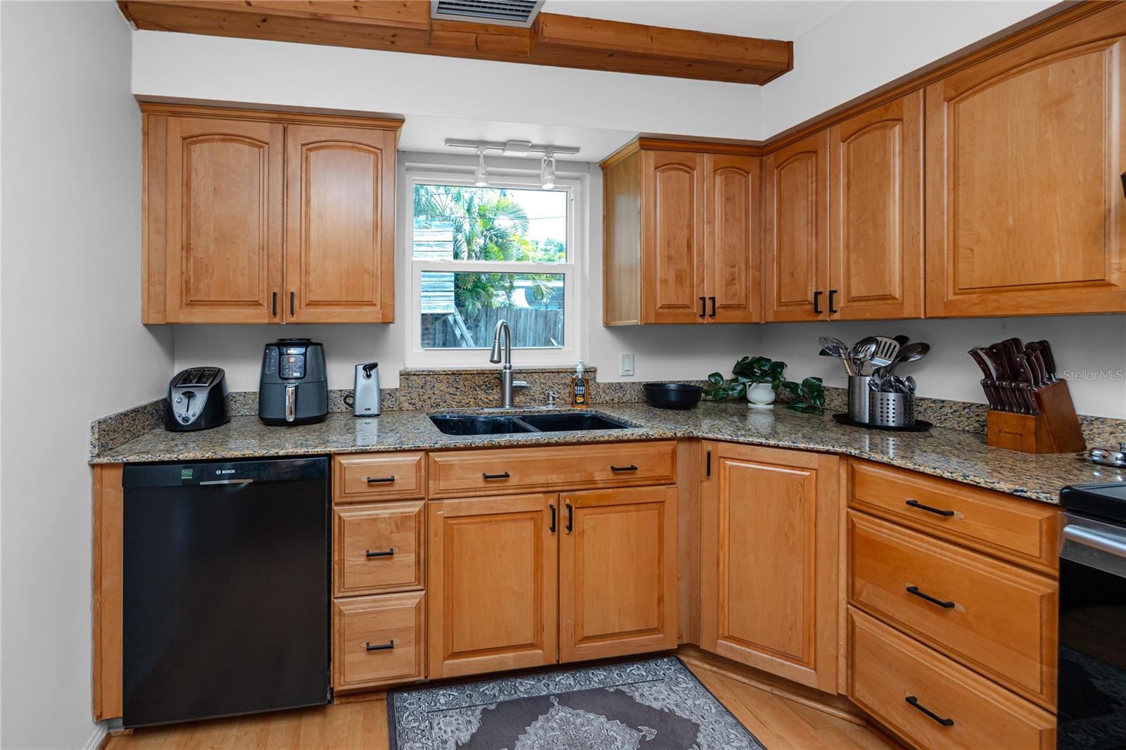 Main House Kitchen 10x20 semi-custom cabinetry with granite