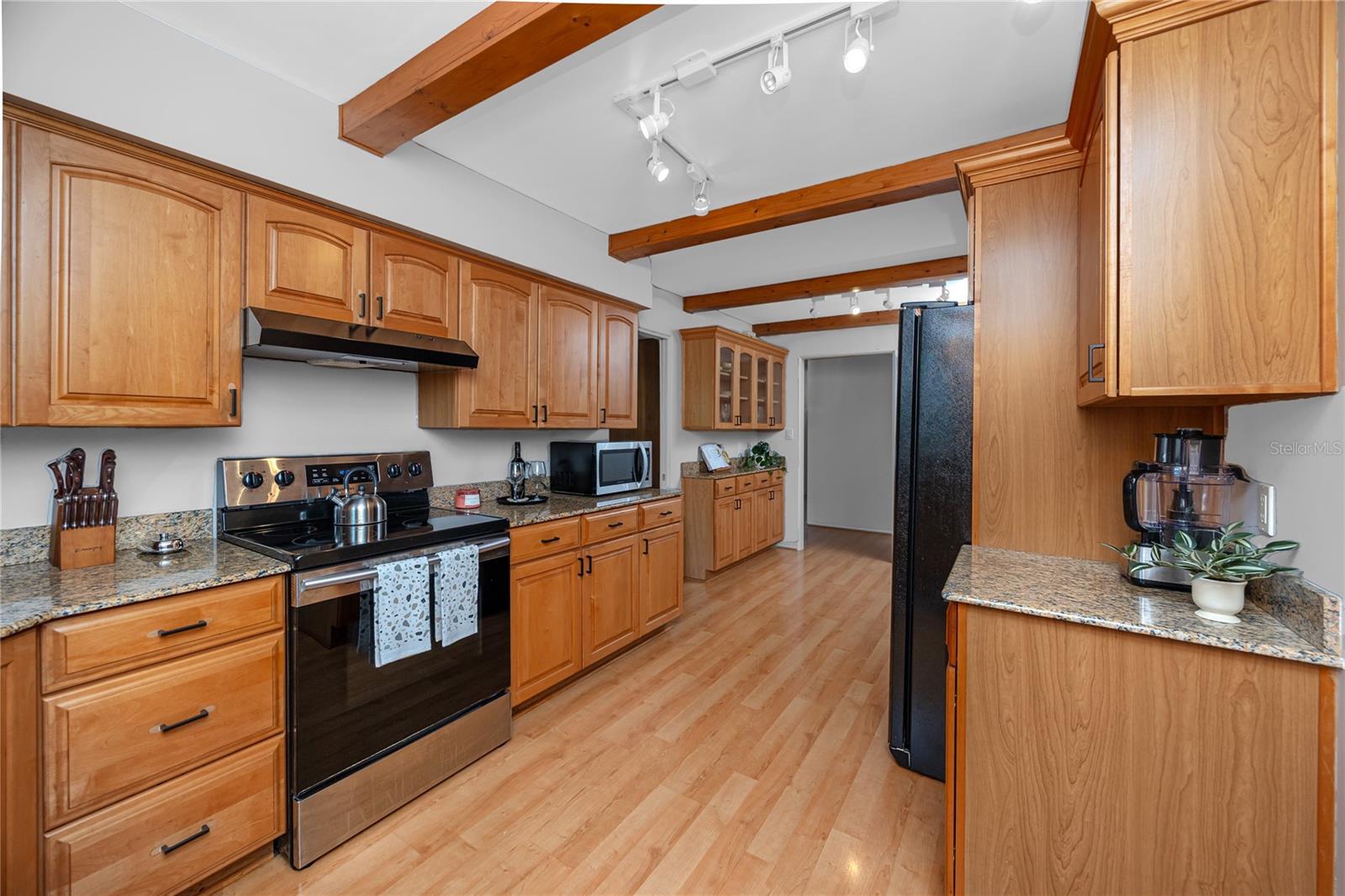 Main House Kitchen 10x20 semi-custom cabinetry with granite counters