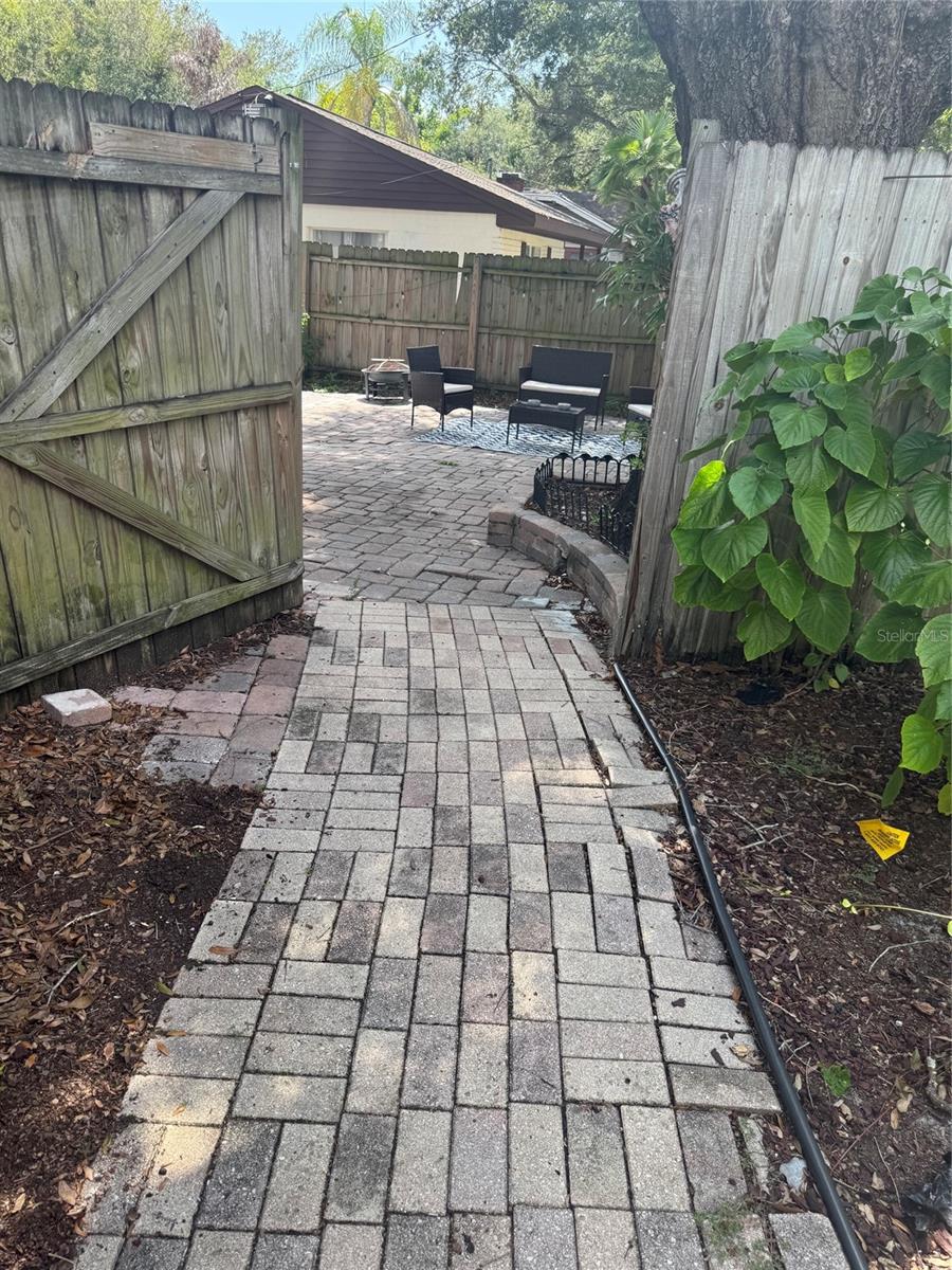 Paved walkway to front of house