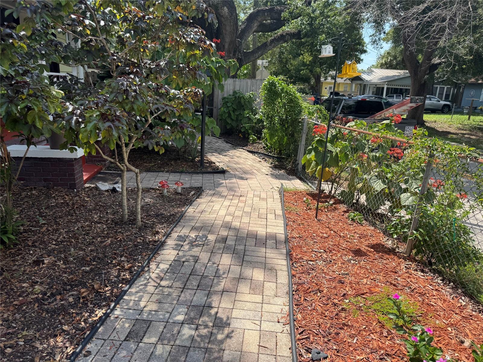 Paved walkway to backyard