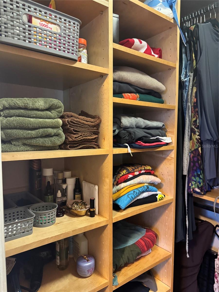 Primary bedroom walk-in closet