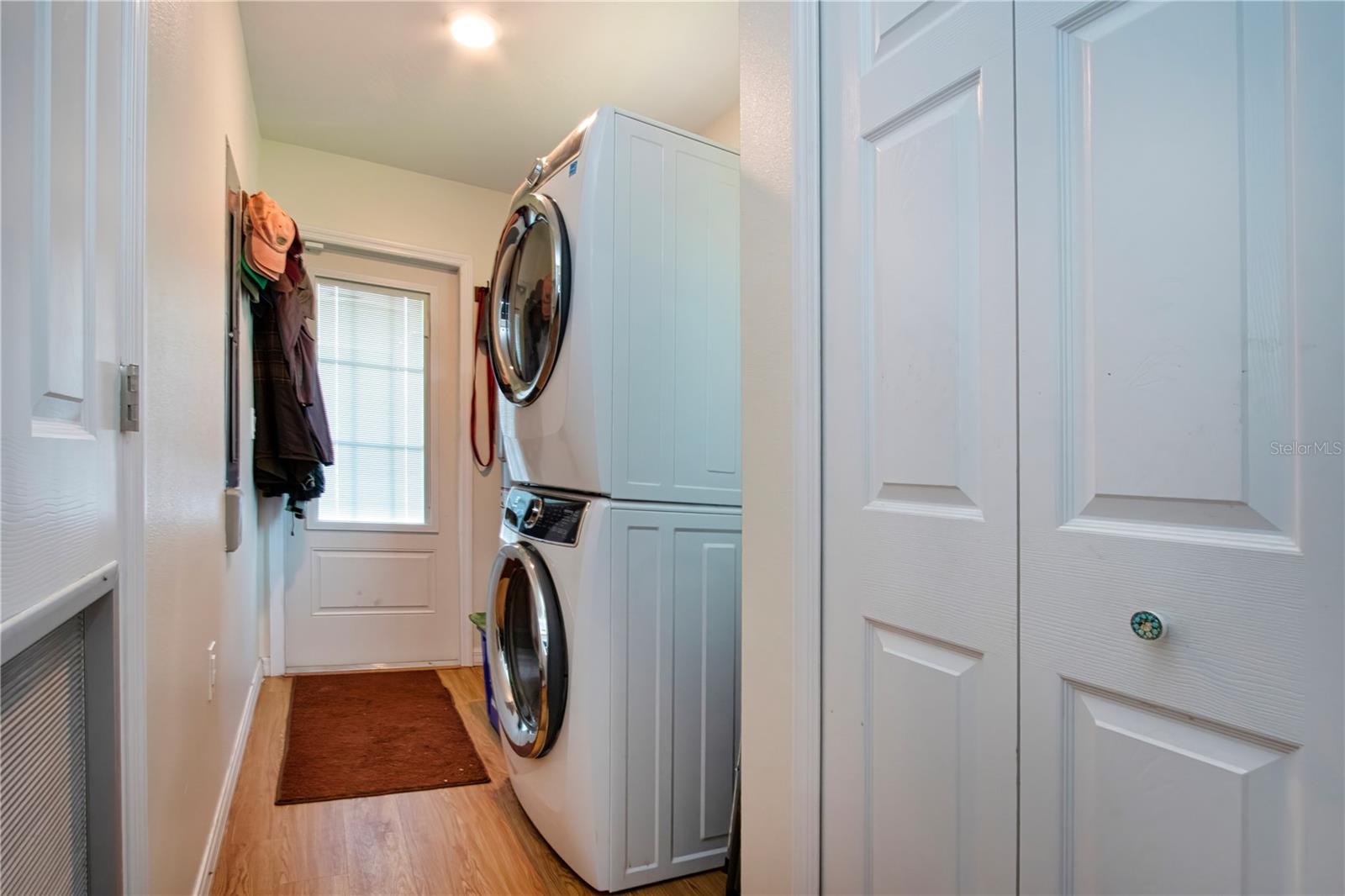 Laundry room, storage closet adjacent to the kitchen