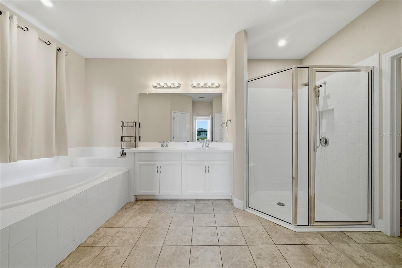 Primary Bathroom with two Walk-in Closets