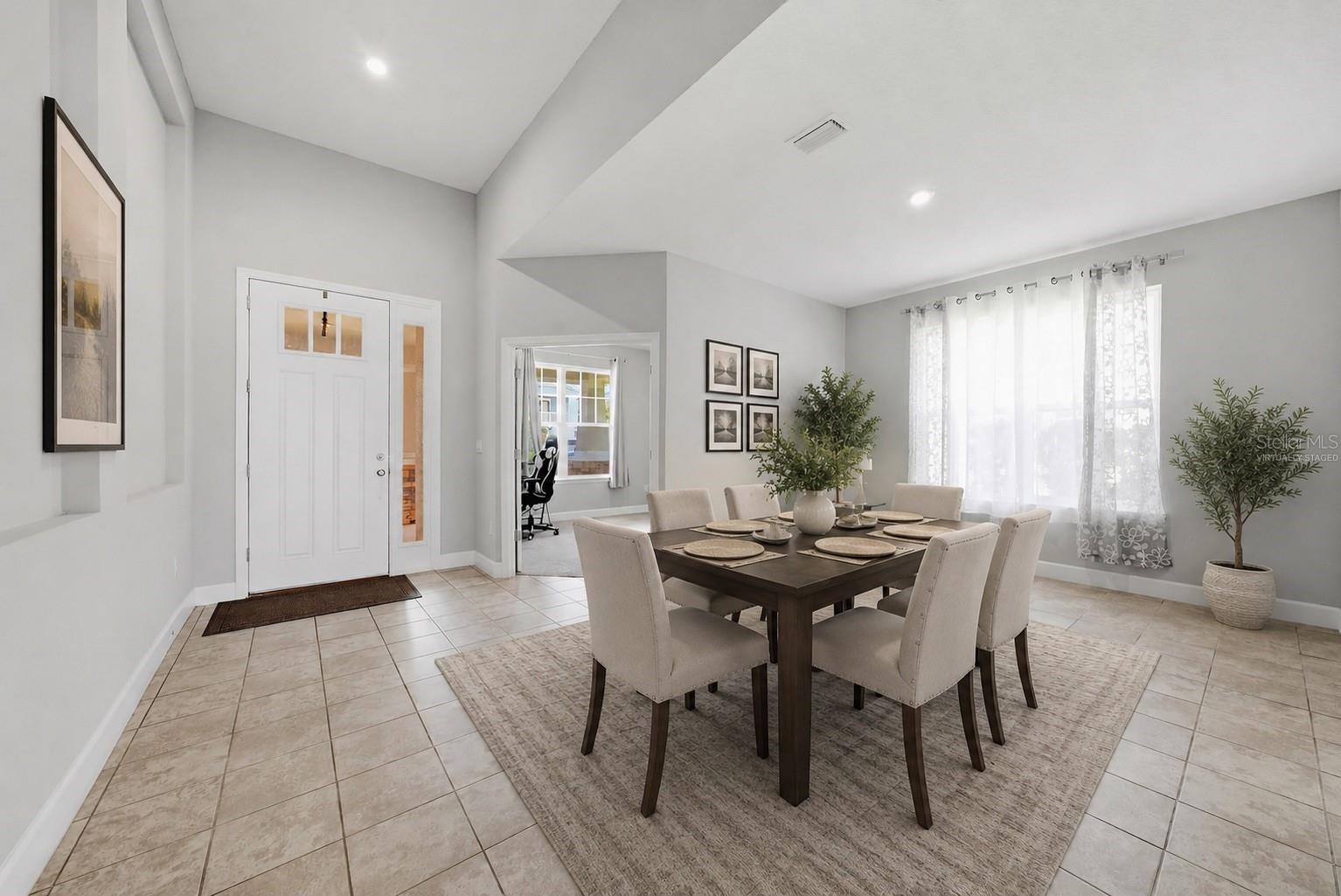 As you enter, the office is on the left front and dining area - Virtually Staged