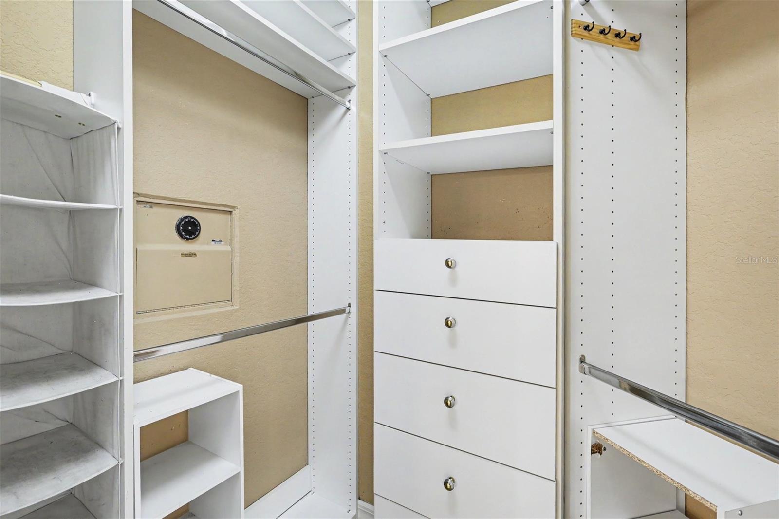 Custom closet with built in safe in Owners Retreat