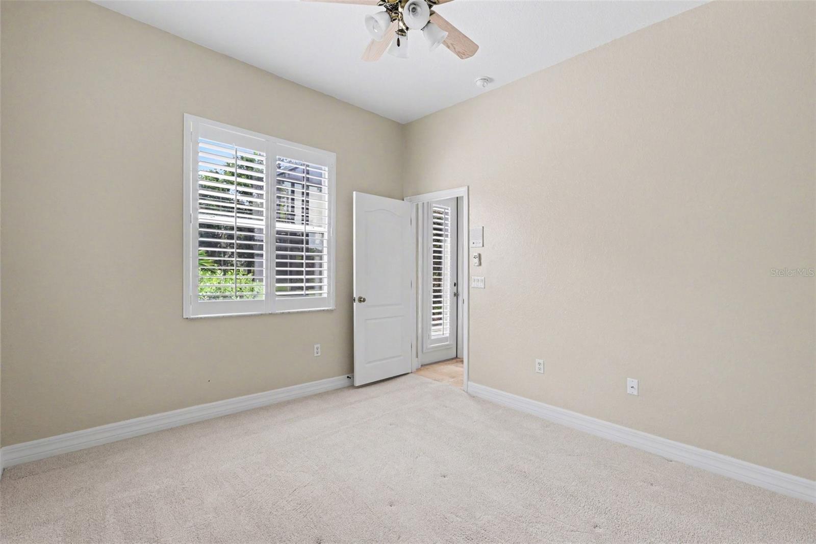 Guest suite located at the rear of the house has exterior entrance/exit door