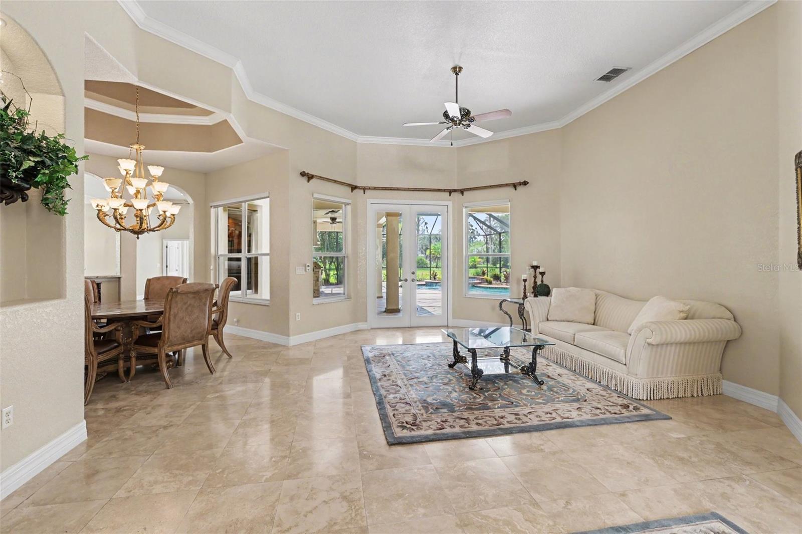 View from the front entry overlooking formal living out to the pool