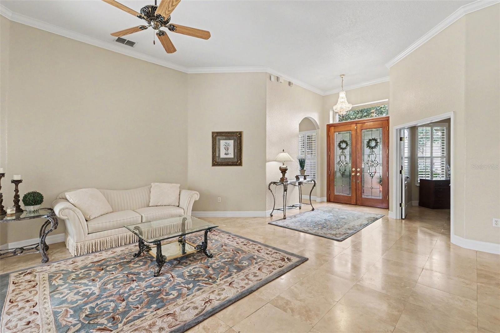 Formal living area highlighted with crown molding