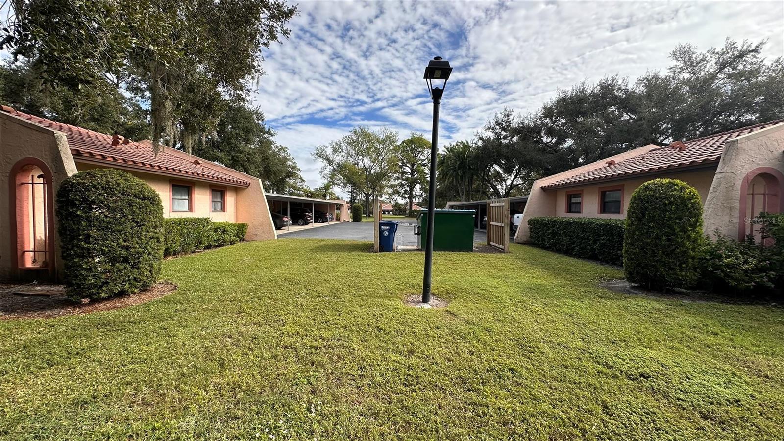 Building 1 and 2 Carport Access. Convenient hidden Trash Receptacle