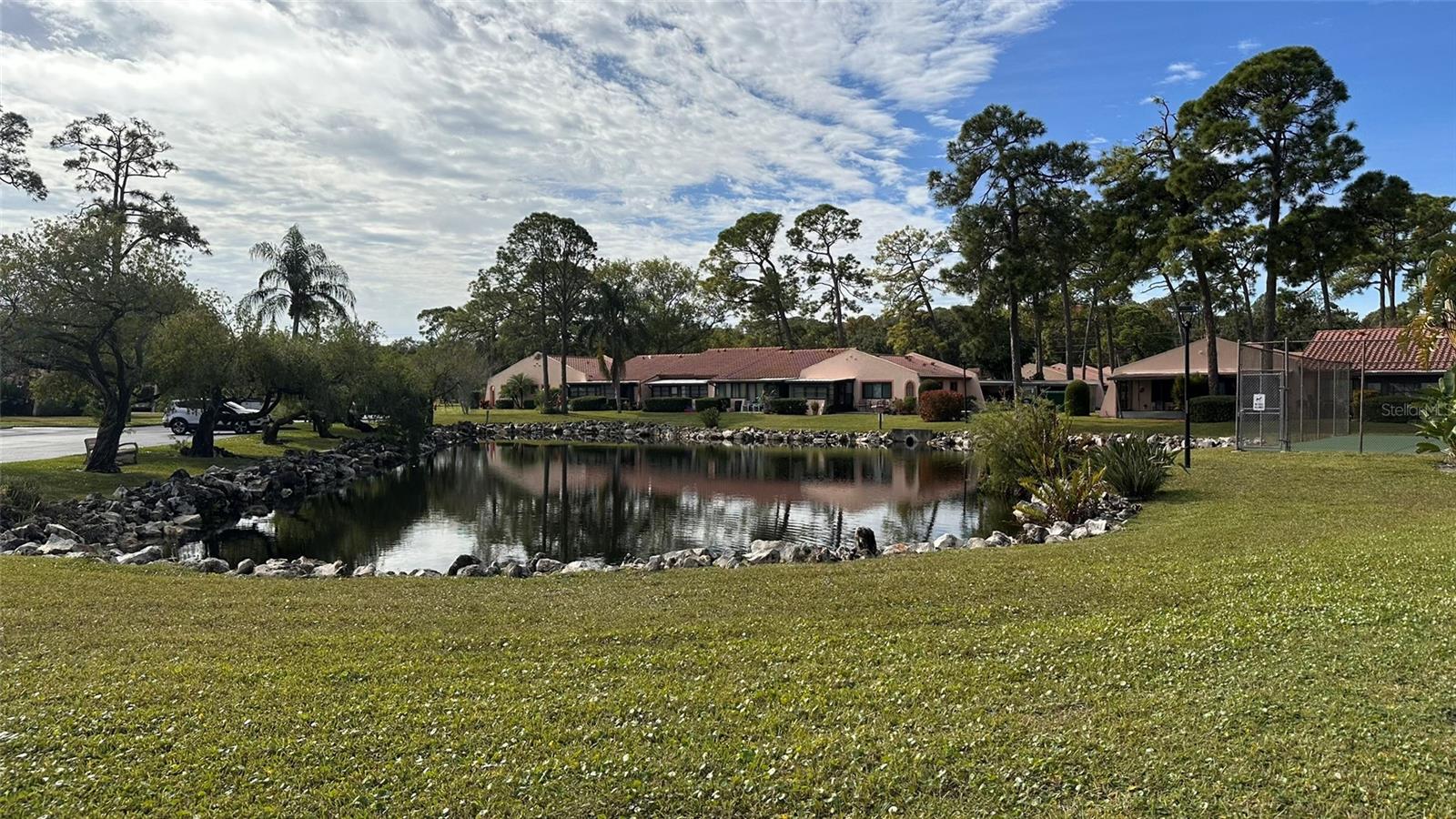 Clubhouse Pond, Tennis and Pickle Ball and Two Buildings