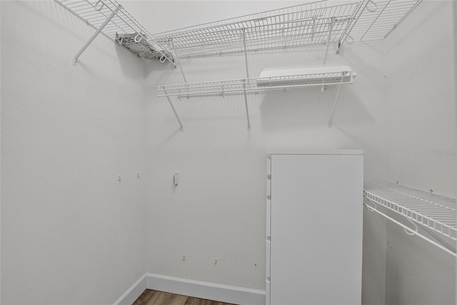 Primary Bedroom Walk in closet 1 of 2