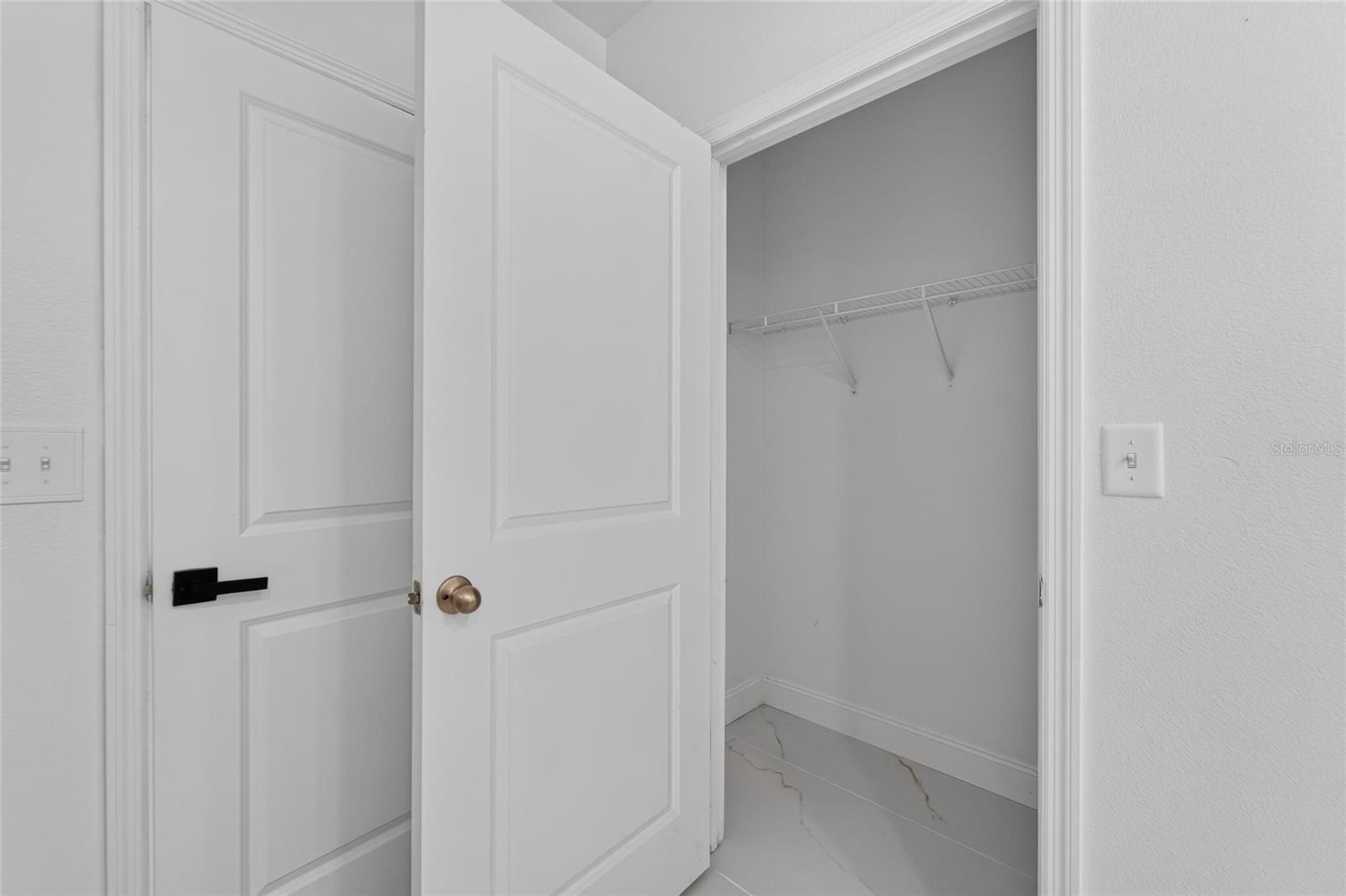 Primary Bedroom Closet 1 of 2