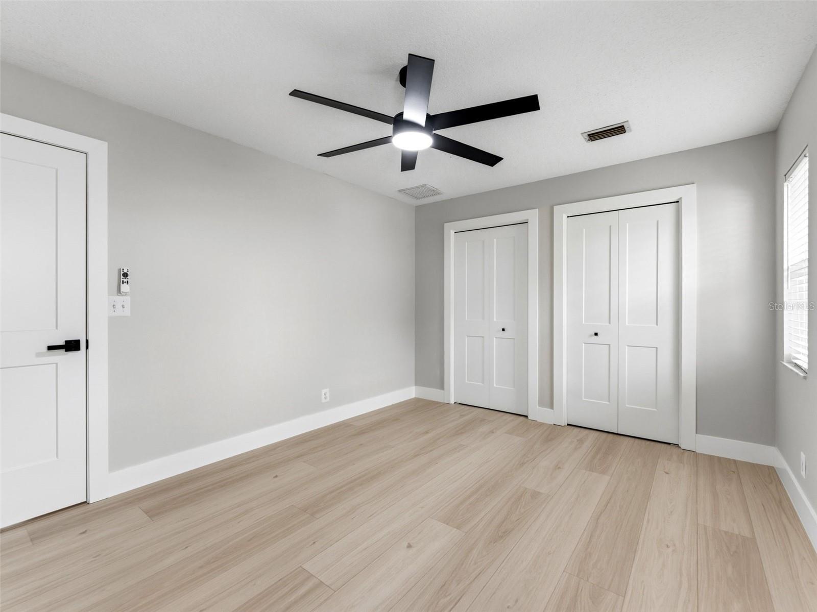 Bedroom 4 with custom closets by closet by design.