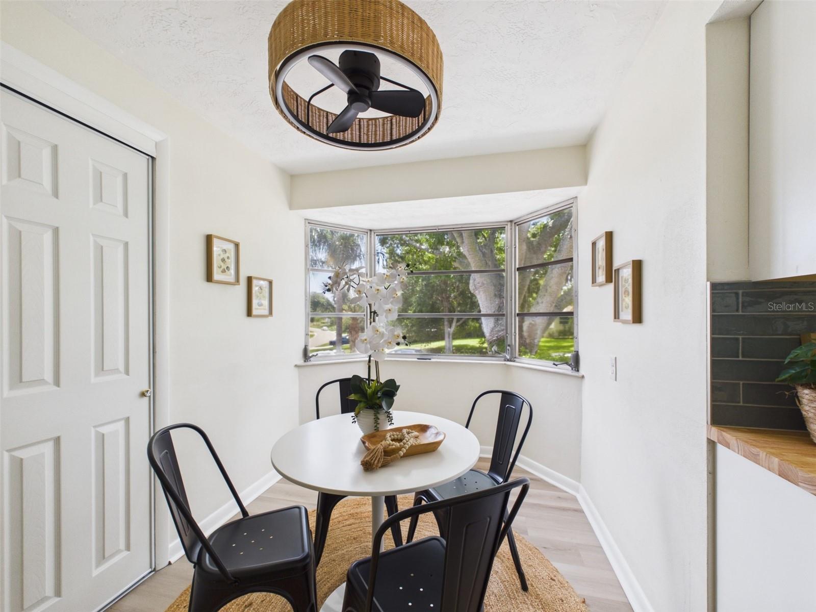 Kitchen nook, with pantry. Perfect for a breakfast table or coffee bar! Beautiful bay windows for a morning view.