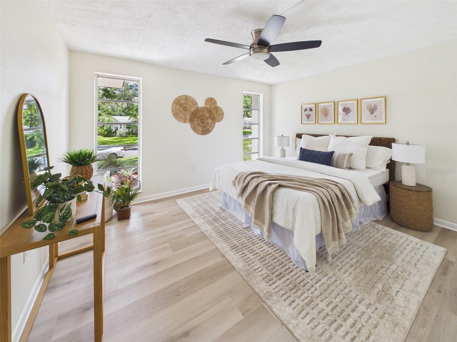 Primary bedroom with beautiful, east-facing windows