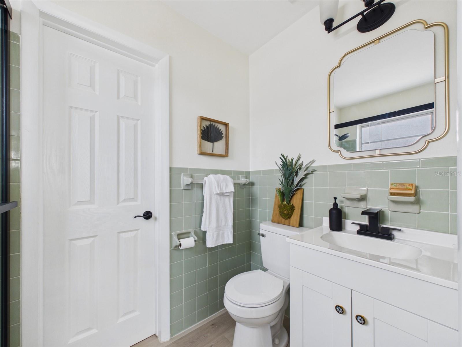 A beautiful blend of original tiles with new bathroom fixtures