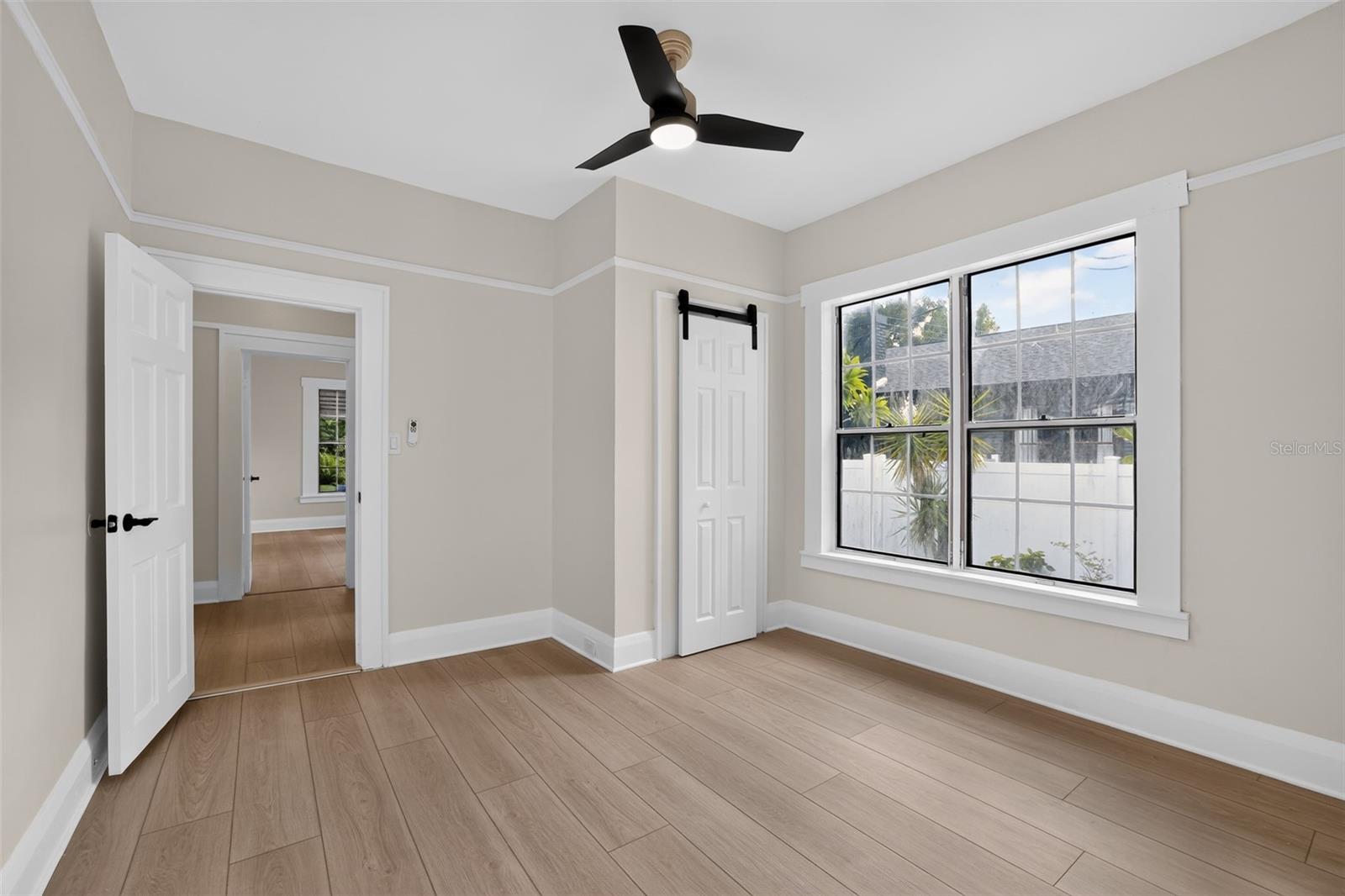 Well-proportioned secondary bedroom (approx. 11' x 12') offering classic charm and comfortable living space in this 1922 bungalow