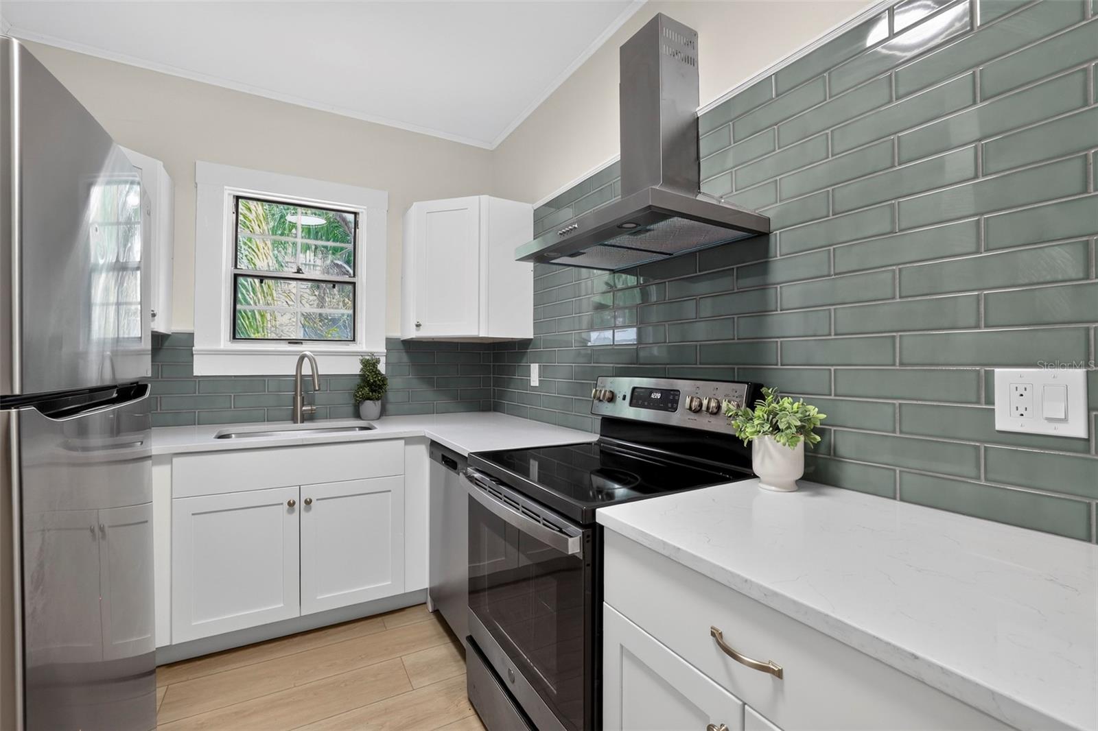 Thoughtfully updated kitchen combining contemporary finishes with charming original bungalow built-in
