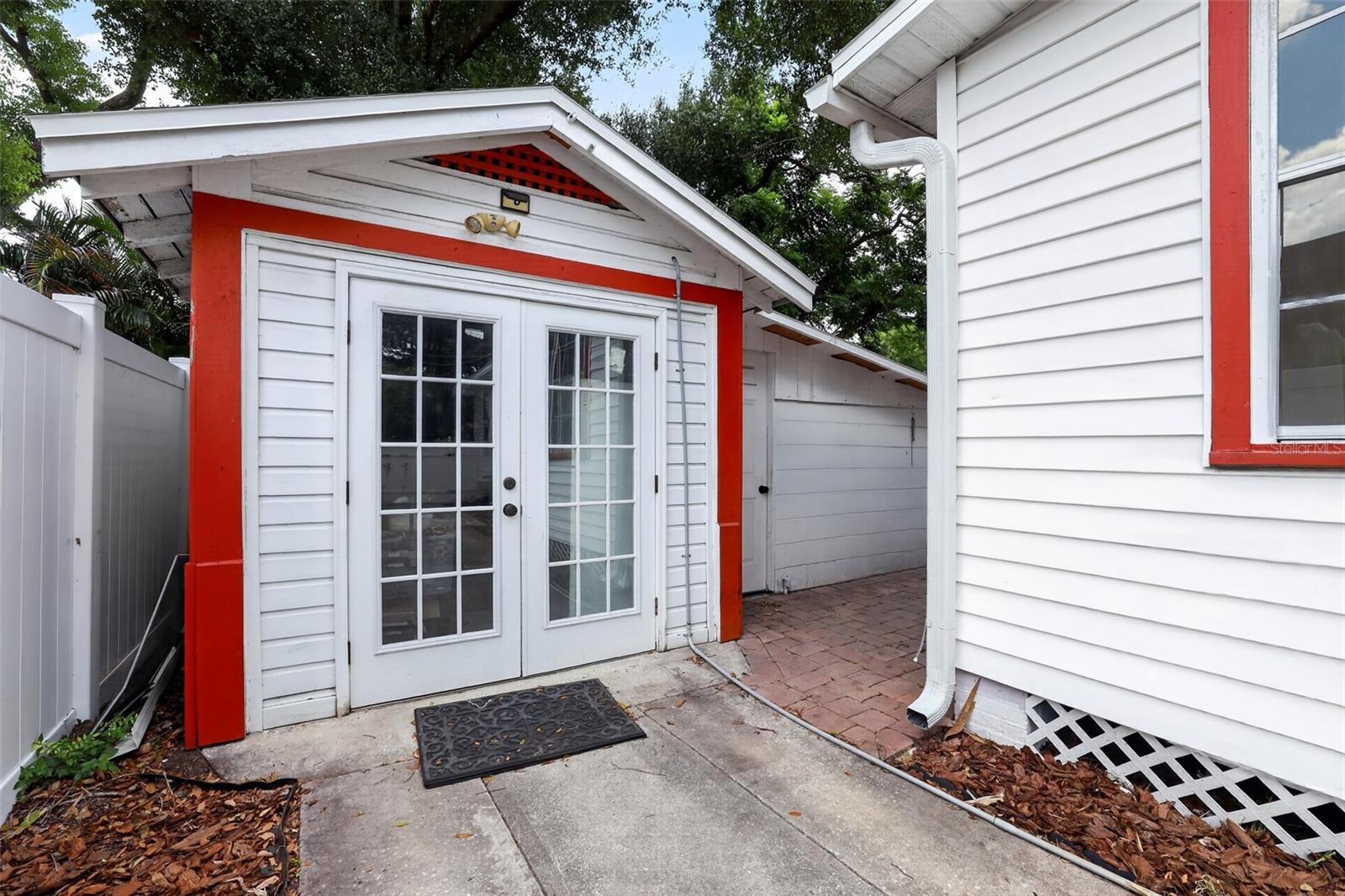 Detached garage with French doors offering parking, laundry, and storage space