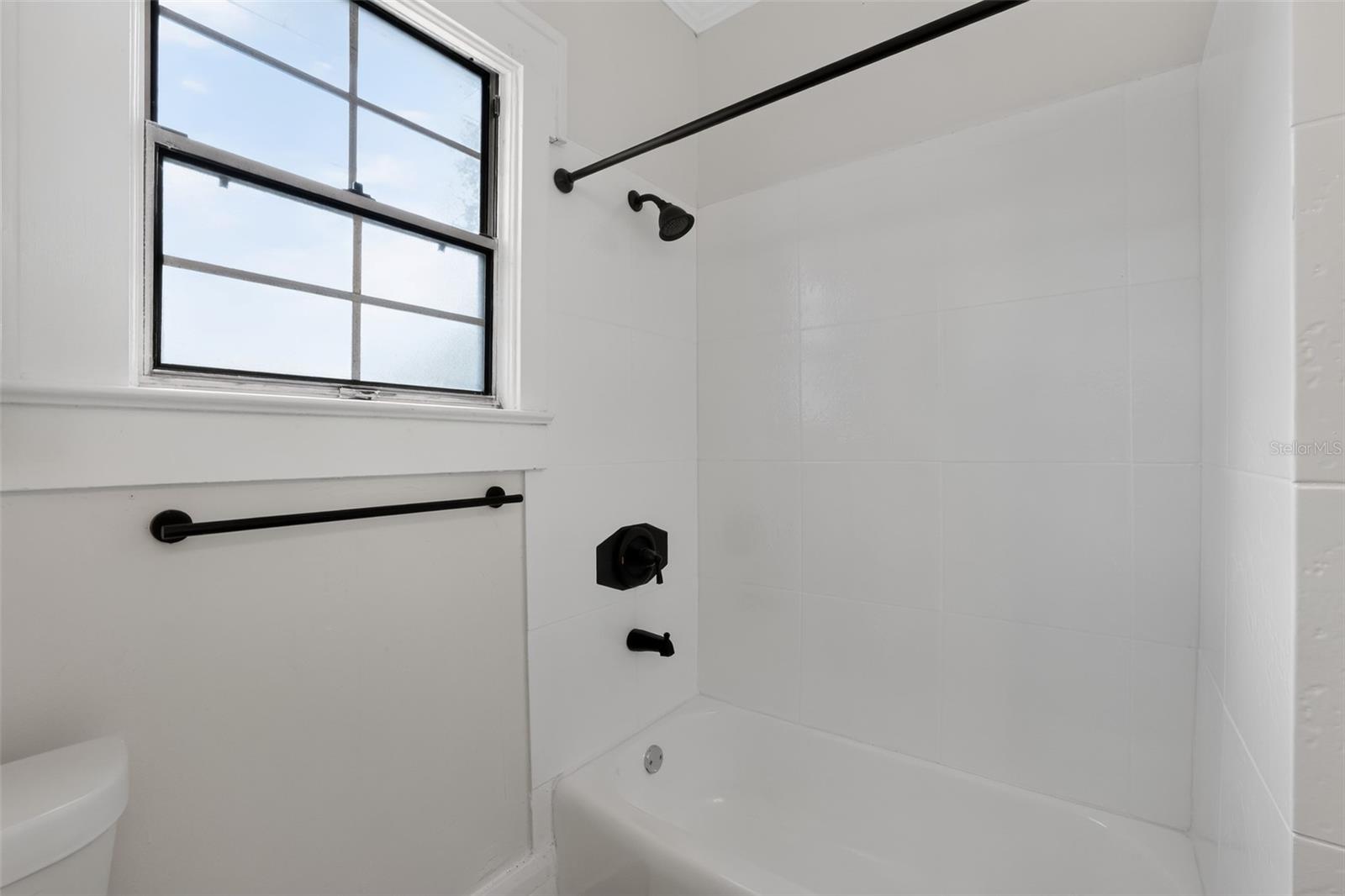 Bright and clean main bathroom in this charming 1922 bungalow
