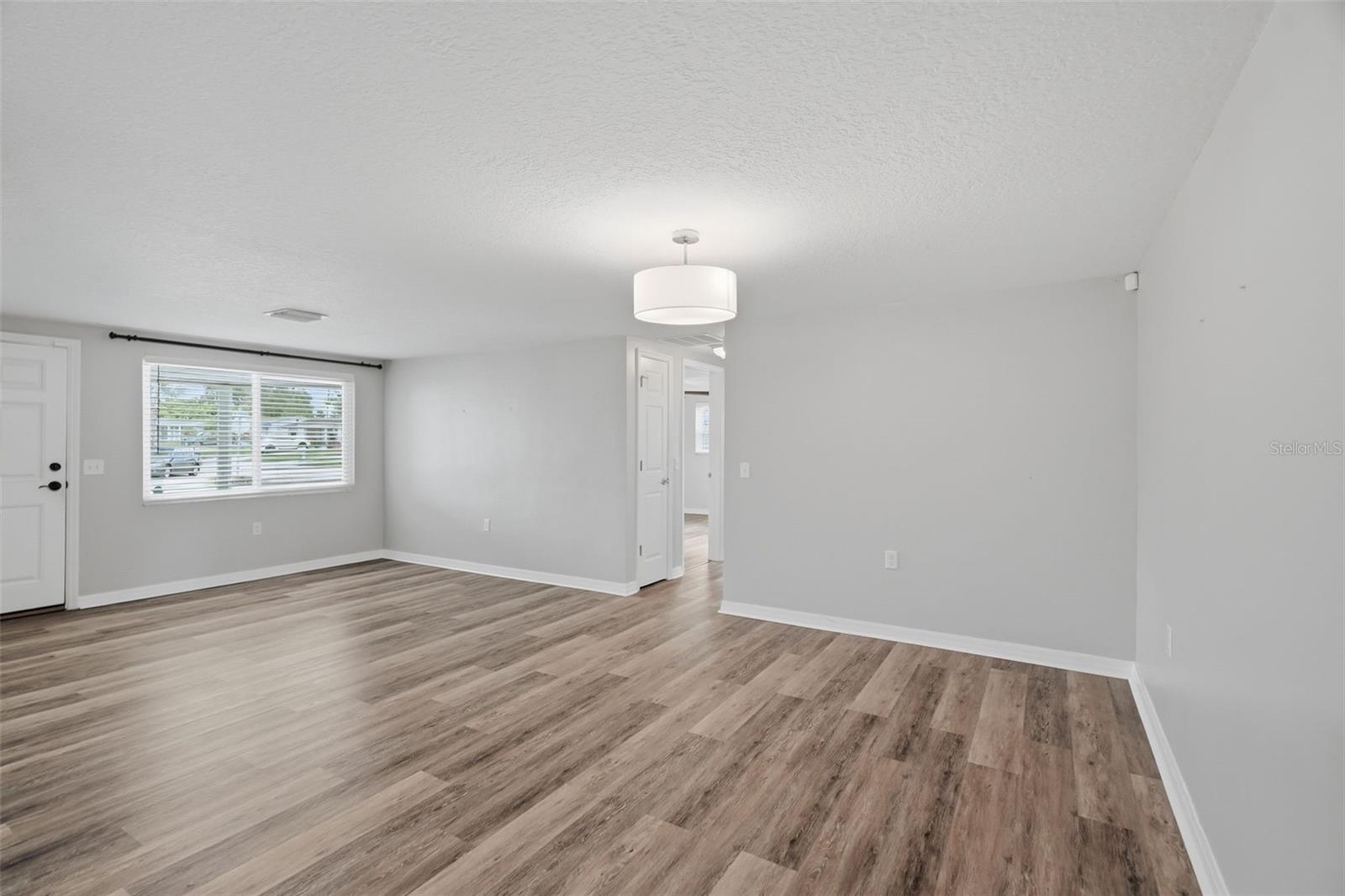 Pass through Dining area to hallway to bedrooms and full bath