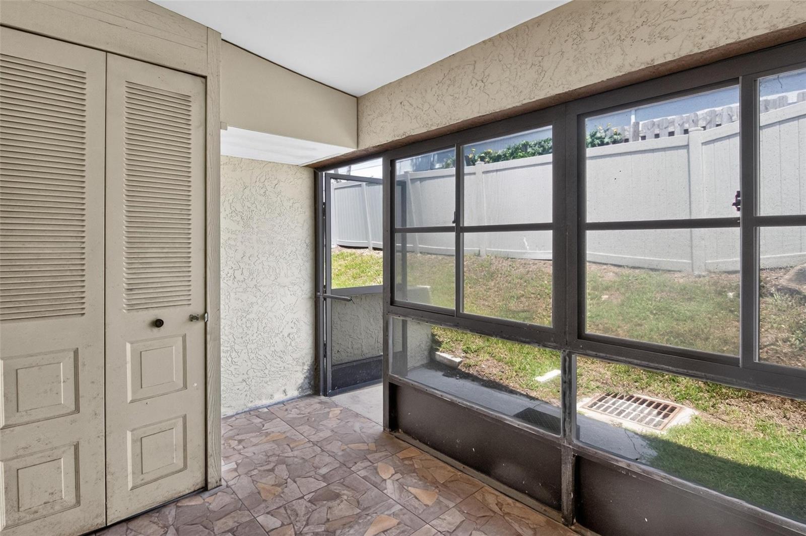 Private closed in rear patio with storage closet