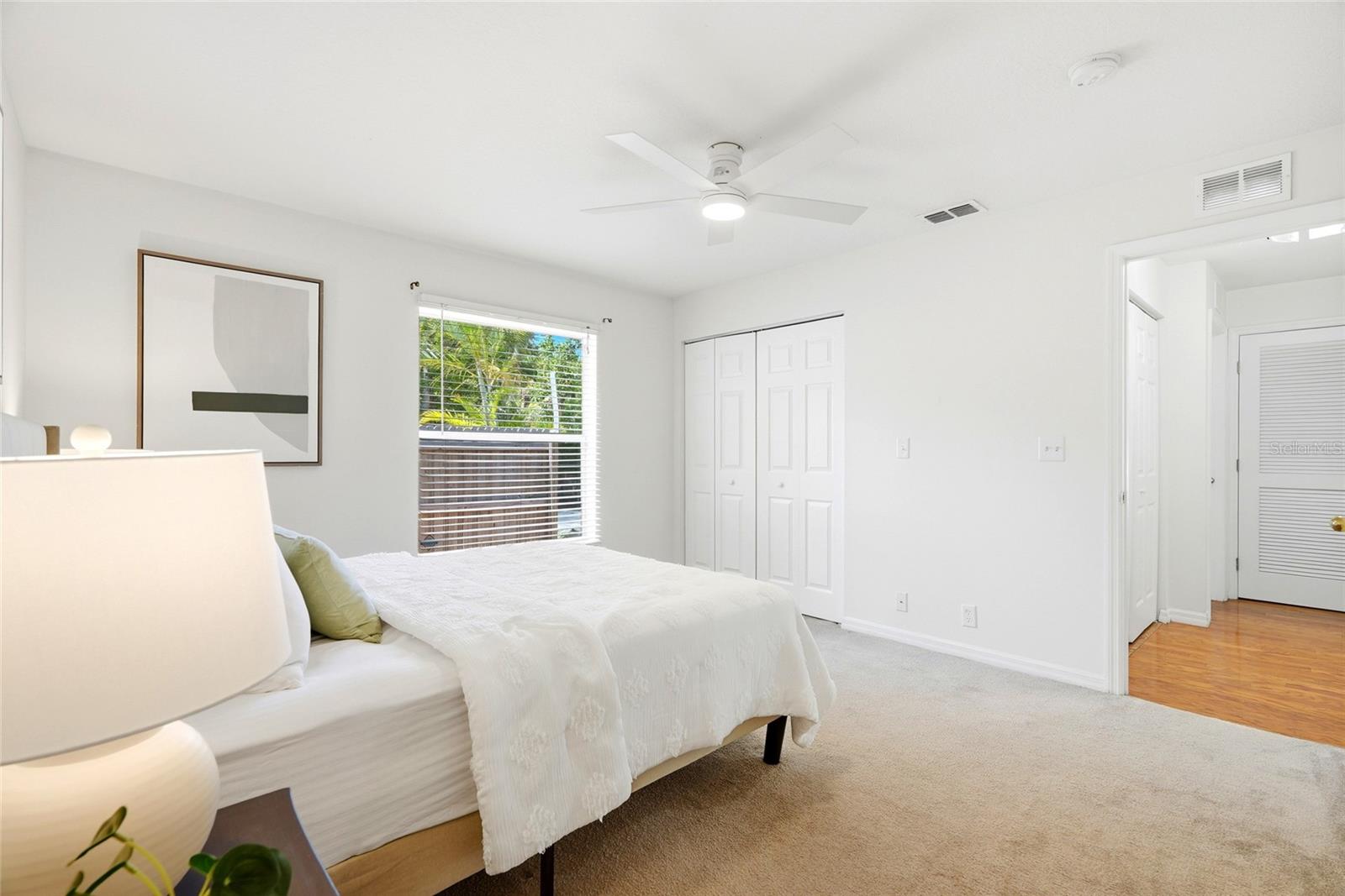 Primary bedroom with remote control fan.