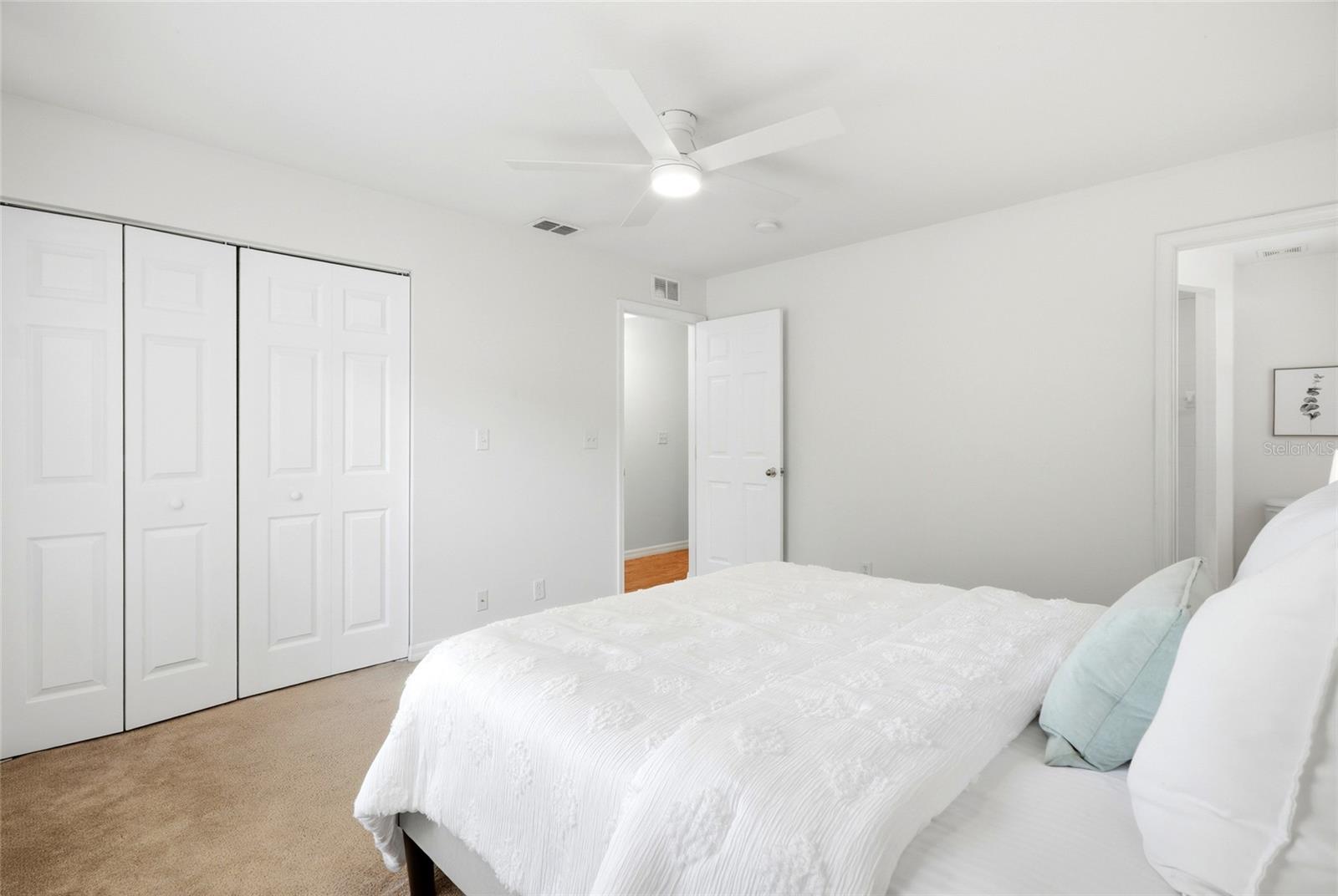 A spacious walk-in closet and private ensuite make this primary suite a true retreat.