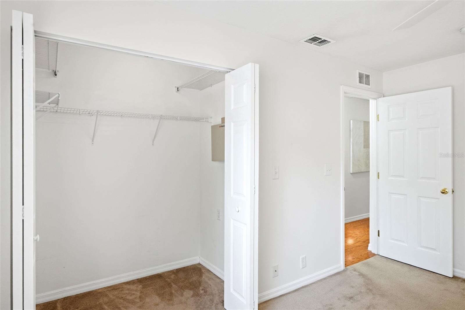 Generous walk-in closet space provides plenty of room for wardrobe and storage.